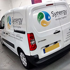 A van adorned in cut out vinyl graphics
