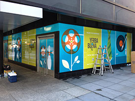 a row of windows with coloured vinyl printed and applied